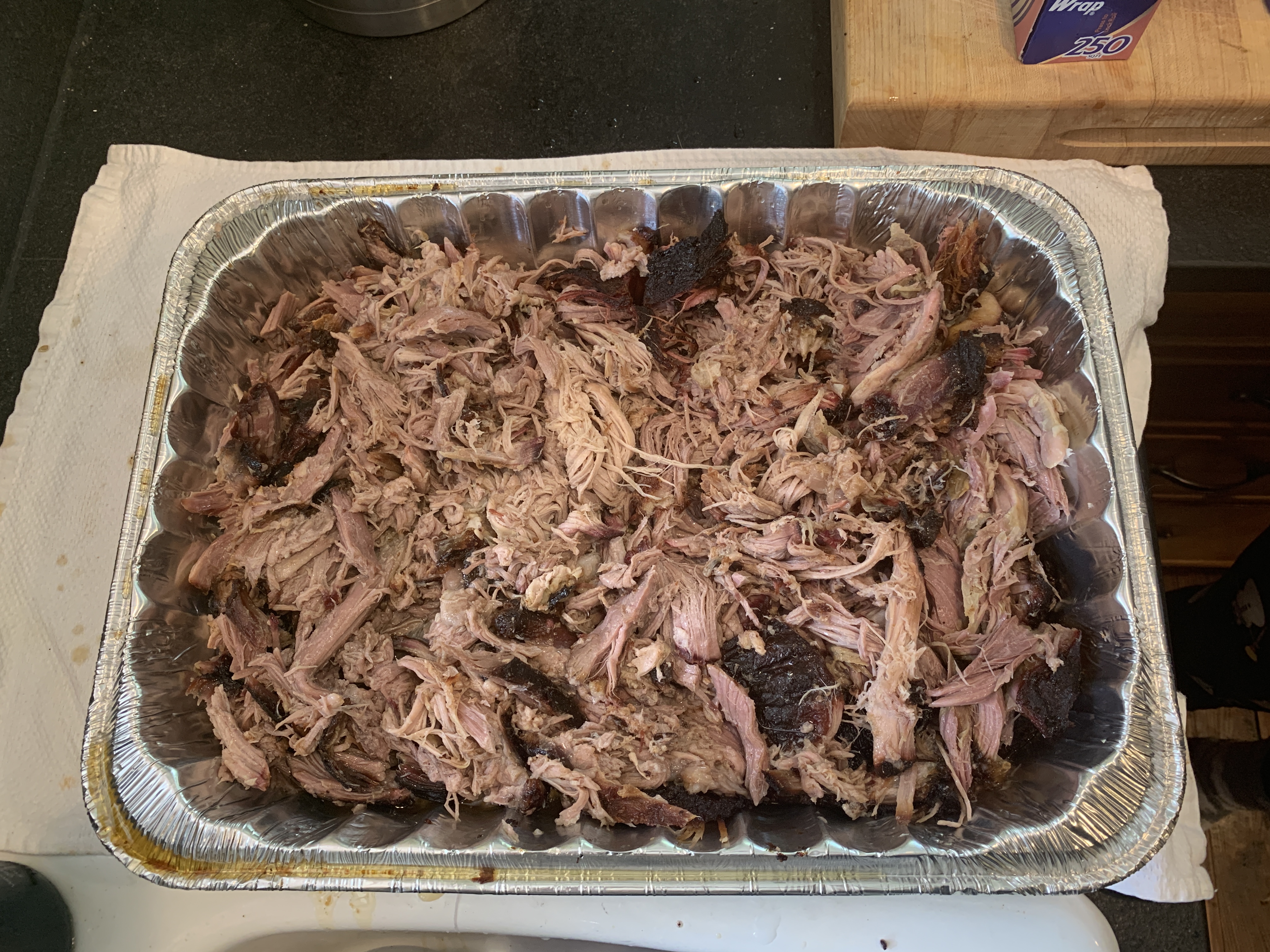 Pork shoulder shredded in pan.